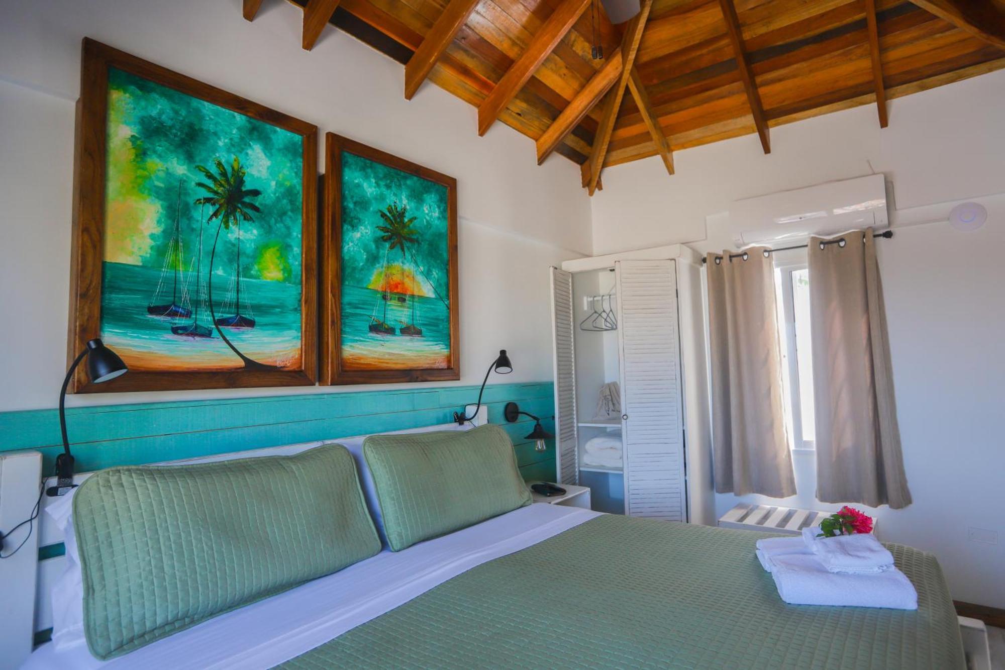 Treetops Hotel Caye Caulker Quarto foto