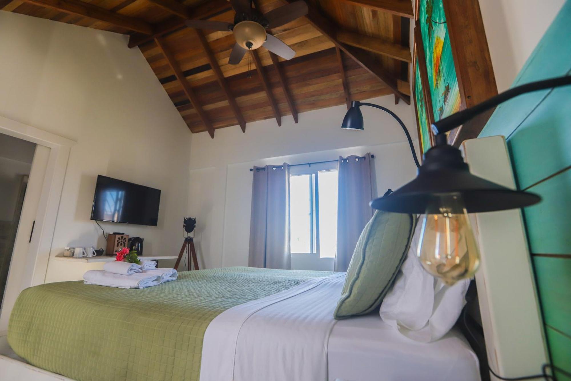 Treetops Hotel Caye Caulker Quarto foto
